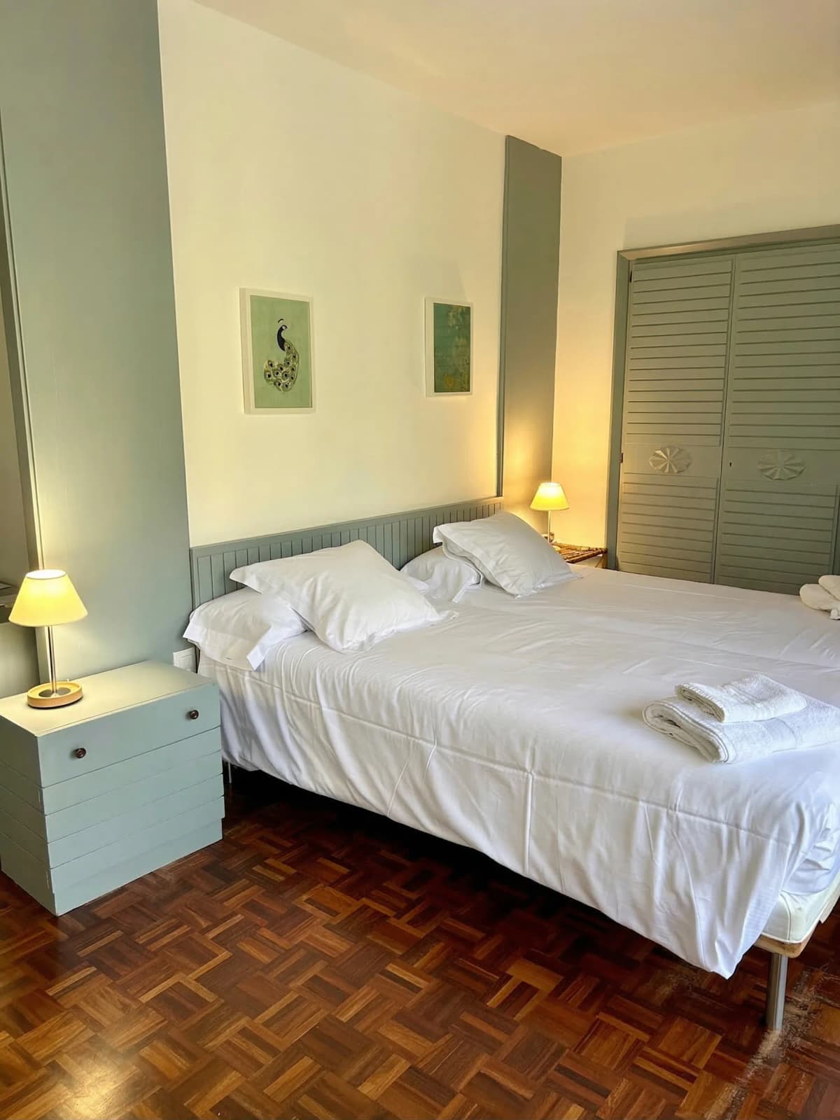 Bedroom with green accent pillows