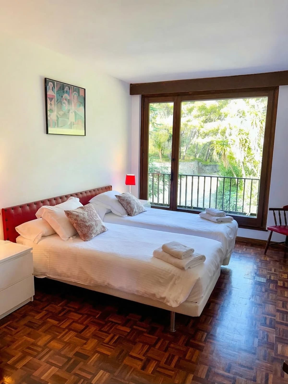 Bedroom with tufted red headboard