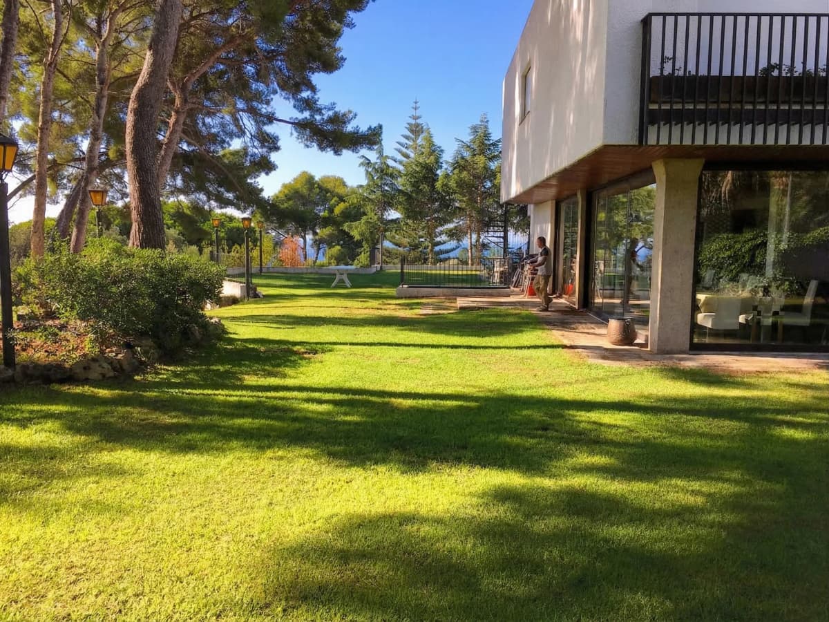 Villa exterior with manicured lawn