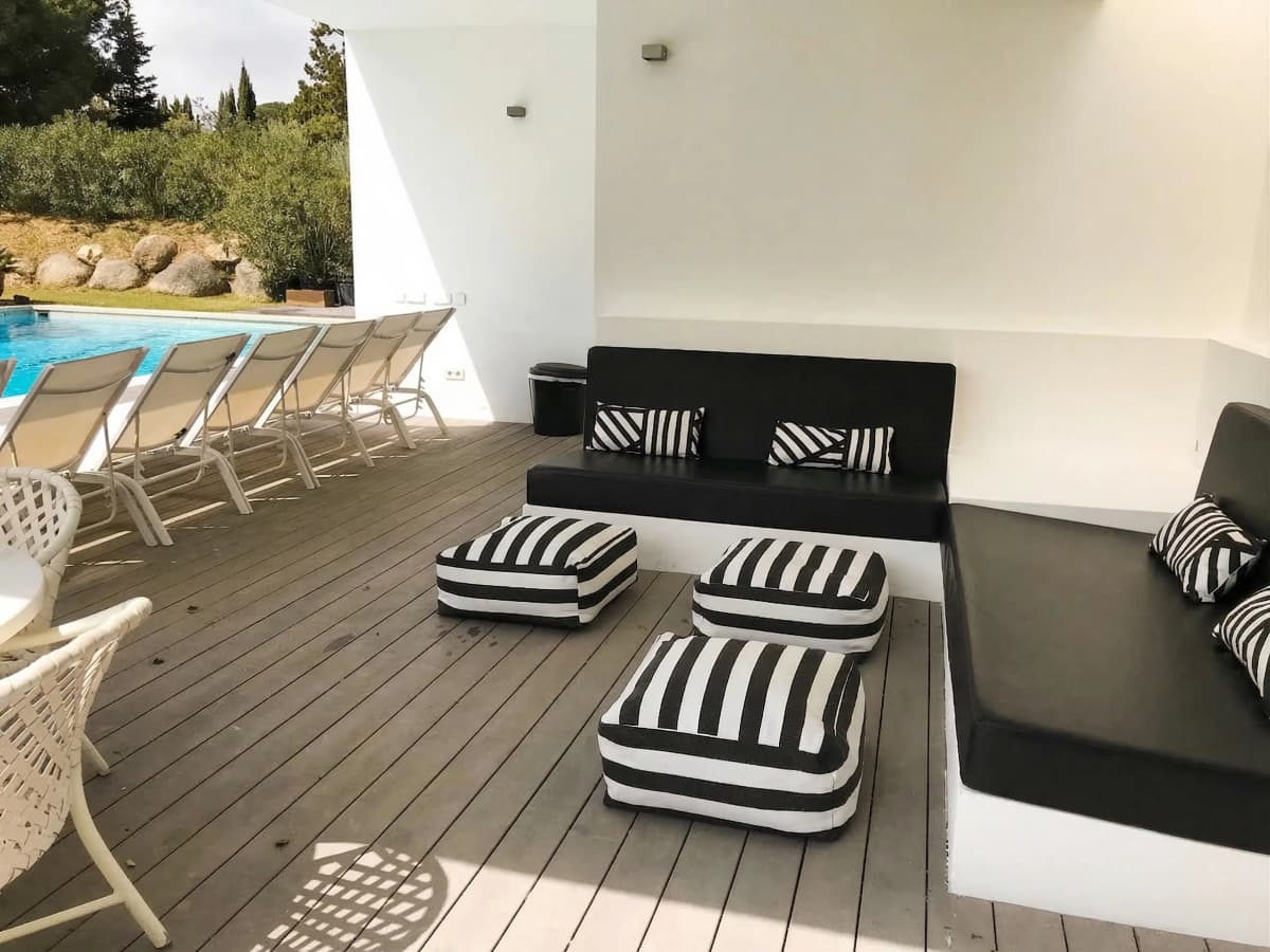 Poolside lounge with striped cushions