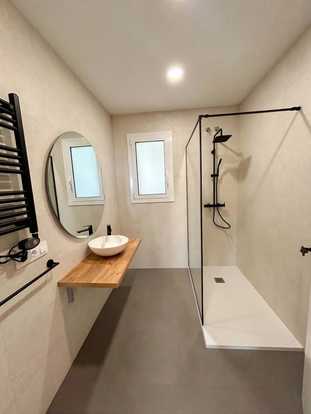 Minimalist bathroom with glass shower