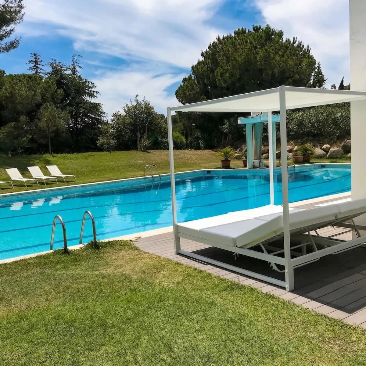 Pool with canopy daybed and loungers