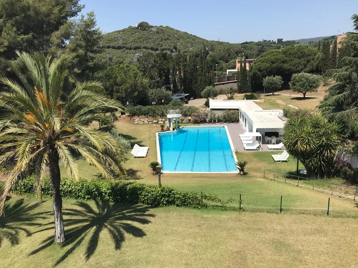 Elevated panoramic view of the pool and gardens